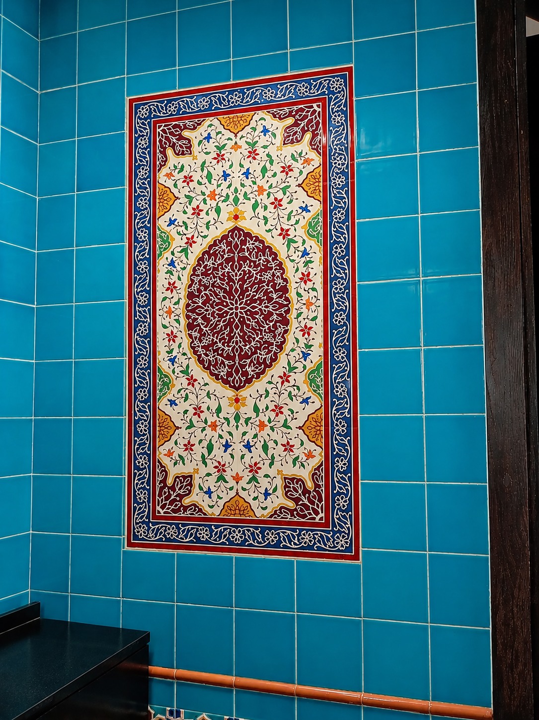 Turquoise Tile Wall With Floral Medallion Panel